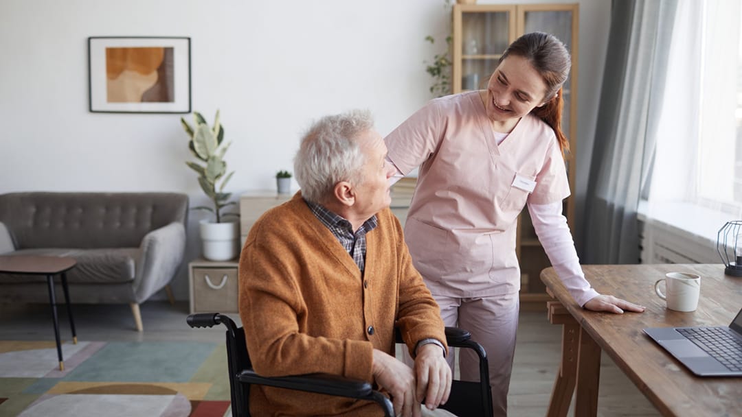Nurse caring for elderly gentleman